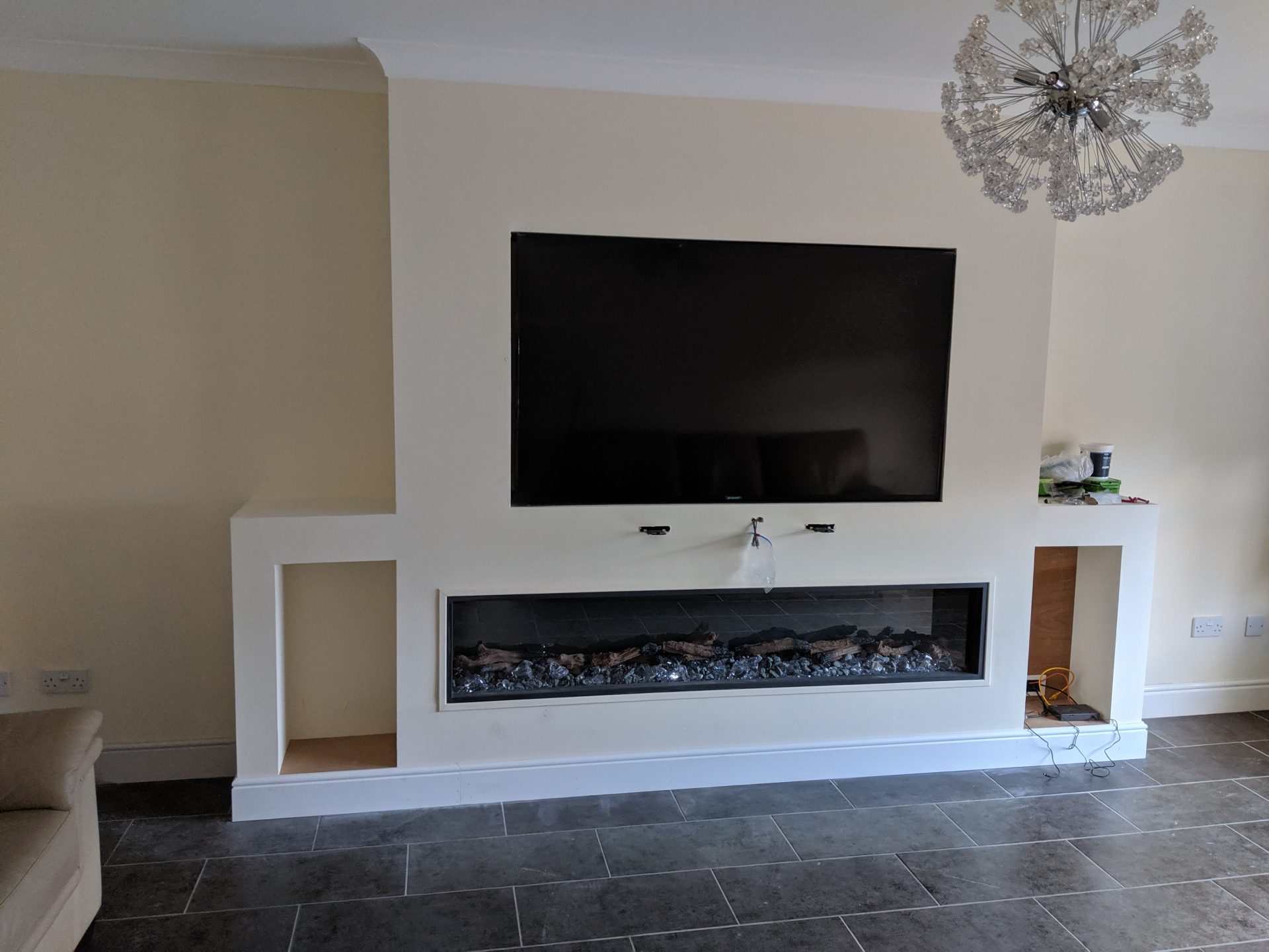 Living room featuring TV and fireplace.